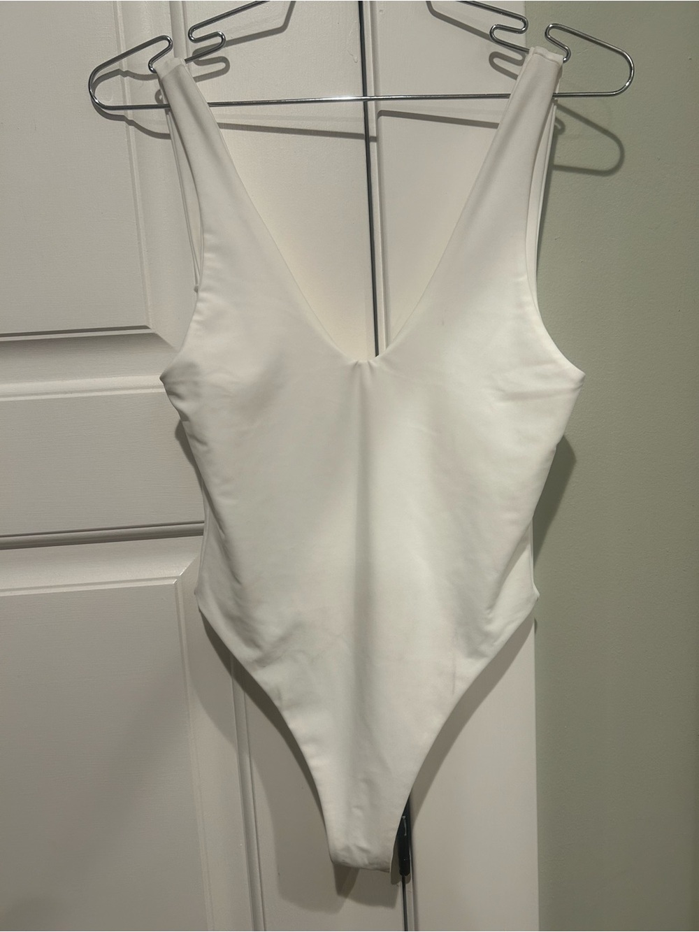 Sleek White V-Neck One-Piece Swimsuit